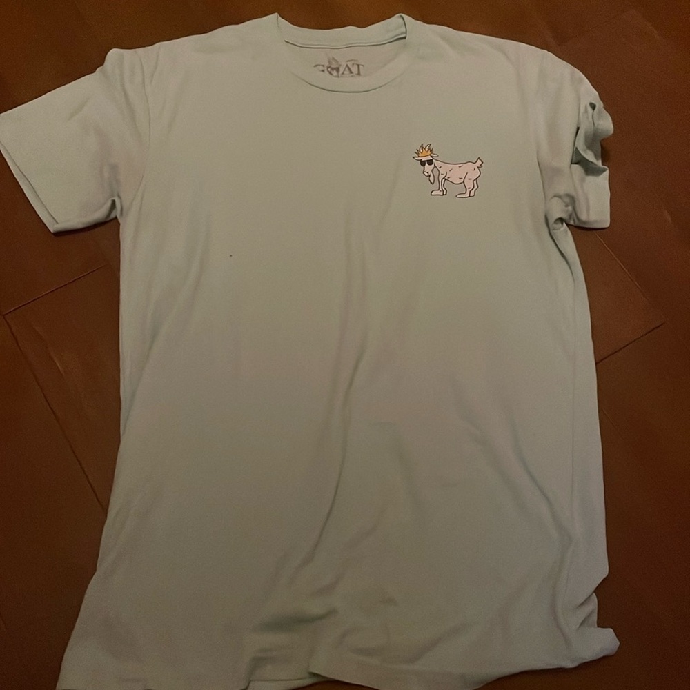 i am selling a greenish blue goat usa shirt